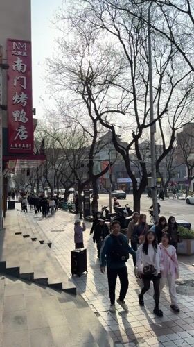 Late night street activity documented in Beijing's Dongcheng District