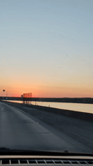 Vehicle travels scenic sunset road near Chaikovsky, Russia