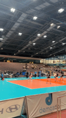 Indoor volleyball game captured at arena facility