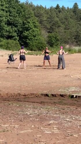 Summer beach day at Zelenaya Roshcha: volleyball, camping, and wildflowers