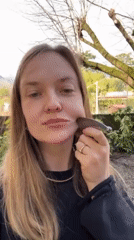 Woman documents facial massage routine with beauty tools in Italy