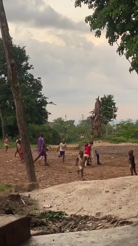 Children play outdoors in rural Igbara, Nigeria village setting