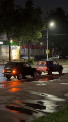 Rainy night street scenes documented in Chaikovsky, Russia