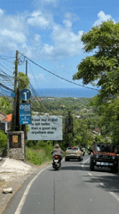 Tourist billboard spotted on Bali street promoting island lifestyle