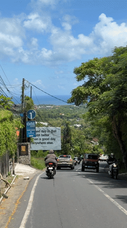 Tourist billboard spotted on Bali street promoting island lifestyle