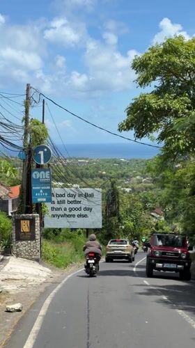 Tourist billboard spotted on Bali street promoting island lifestyle