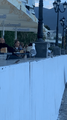 Seaside promenade life captured in afternoon coastal scenes