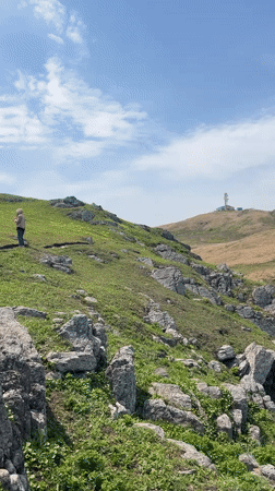 Coastal cliffs and communications tower documented in Mayak Byusse