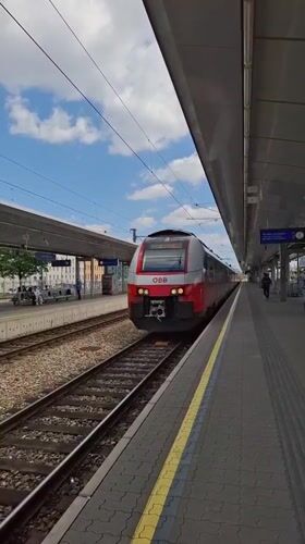Spring morning in Vienna: train arrival, blooming flowers