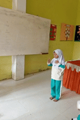 Students in a colorful Indonesian classroom, mid-activity