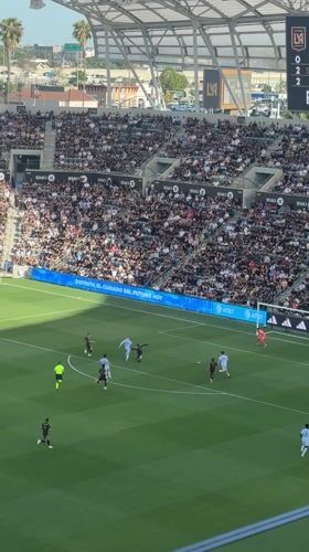 Soccer match underway at packed BMO Stadium in Los Angeles