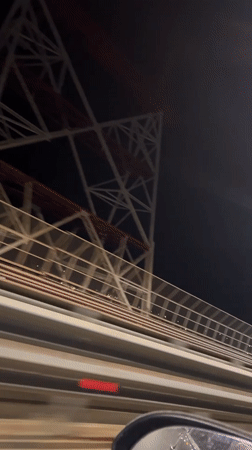 Nighttime bridge crossing recorded near Russian forest district