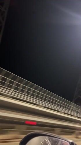 Nighttime bridge crossing recorded near Russian forest district