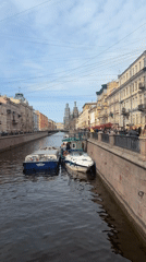 Canal scene with docked boats documented in Saint Petersburg