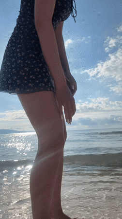 Woman takes beach selfies in sunny Nesebar, Bulgaria morning