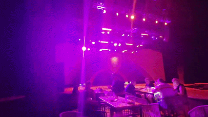 DJ set lights up a venue with colorful stage production