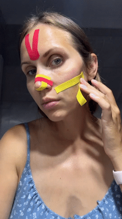 Woman takes bathroom selfies with kinesiology tape in Fethiye