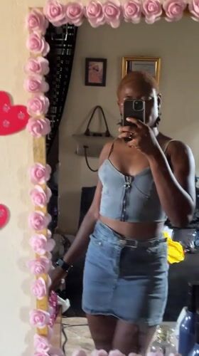 Woman takes mirror selfies in Jalingo, Nigeria indoor setting