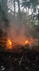 Small fires burning through dry jungle vegetation in Lhokseumawe