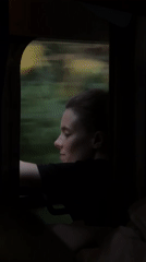 Quiet moment looking out a train window in Rakovica, Serbia