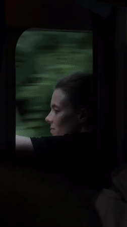 Quiet moment looking out a train window in Rakovica, Serbia
