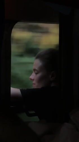 Quiet moment looking out a train window in Rakovica, Serbia