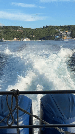 Passenger ferry crosses waters near Kampung Toyapakeh, Indonesia