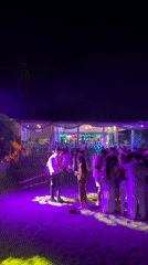 Beach club night in Estepona: DJ, bonfires, and purple lights