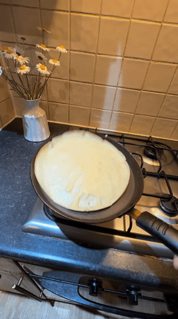 Person cooks pancakes in Great Yarmouth kitchen Tuesday evening