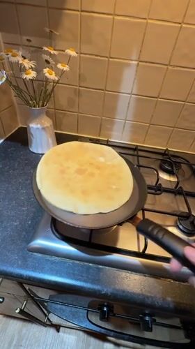 Person cooks pancakes in Great Yarmouth kitchen Tuesday evening