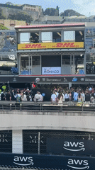 Racing event observed at Monaco venue with corporate signage