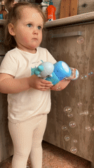 Child plays with bubbles, couple spends time in Chaikovsky