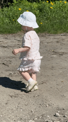 Toddler's morning walk captured in Russian village park