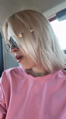 Woman talks, smiles in car in Engels, Russia
