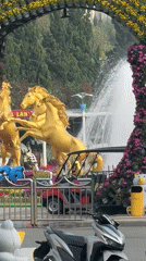Ornate golden roundabout captured in Da Lat street scene