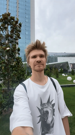 Young man in cat t-shirt spotted outdoors in Tashkent