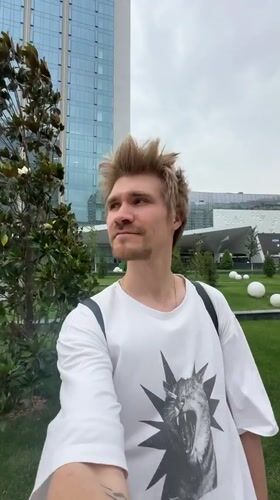 Young man in cat t-shirt spotted outdoors in Tashkent