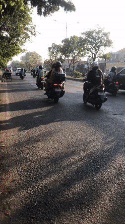 Morning traffic flows through three Indonesian villages near Sidoarjo