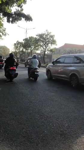 Morning traffic flows through three Indonesian villages near Sidoarjo