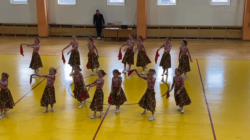 Girls perform folk dance in Russian gymnasium