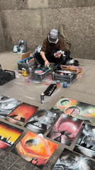 Street artist, costumed tourists enliven Saint Petersburg's Palace Square