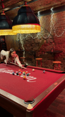 Woman plays pool at Krasnoyarsk bar