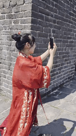 Posing in traditional red dress at Shanhaiguan Great Wall