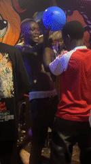 Young adults gather at dimly lit venue in Durimi Nigeria