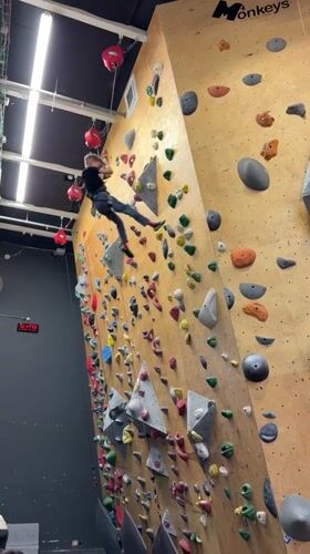 Children learn indoor rock climbing at Netanya gym