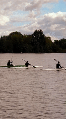Kayaking and river traffic on a Riga waterway