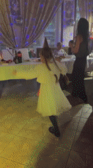 Indoor party celebration with dancing captured in Chaikovsky, Russia