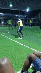 Men play recreational soccer on indoor turf field