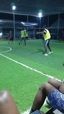 Men play recreational soccer on indoor turf field