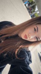 Woman Takes Selfie at Gas Station in Plovdiv
